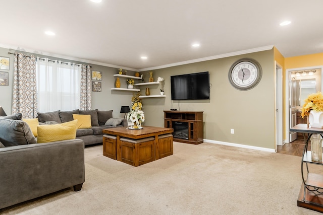 carpeted living room with ornamental molding