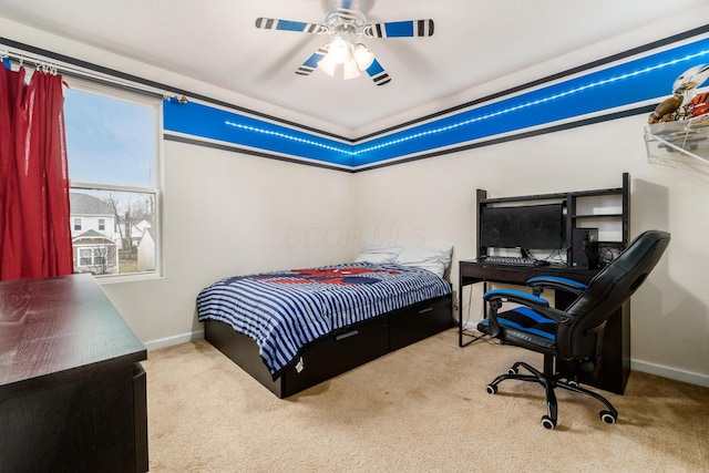 bedroom featuring light carpet and ceiling fan