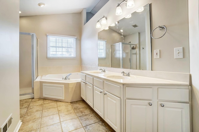 bathroom with vanity and separate shower and tub