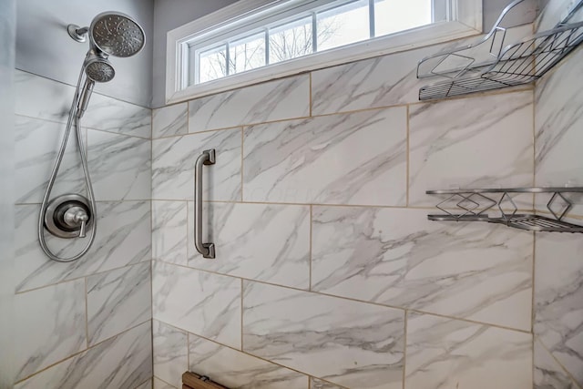 bathroom with tiled shower