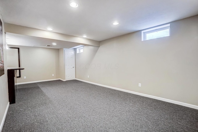 basement with dark carpet