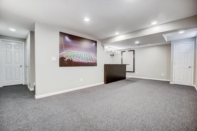 interior space featuring dark colored carpet