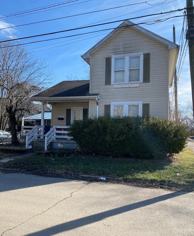 view of property with covered porch