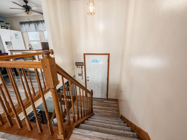 staircase with ceiling fan