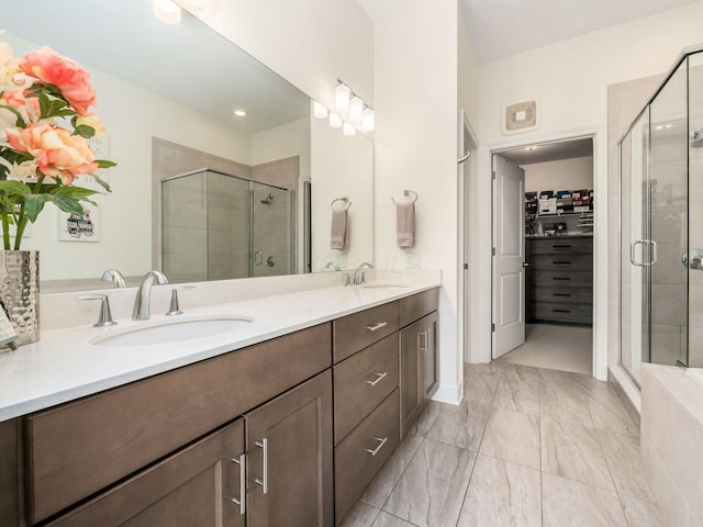 bathroom with vanity and an enclosed shower