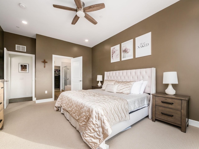 bedroom featuring light carpet and ceiling fan