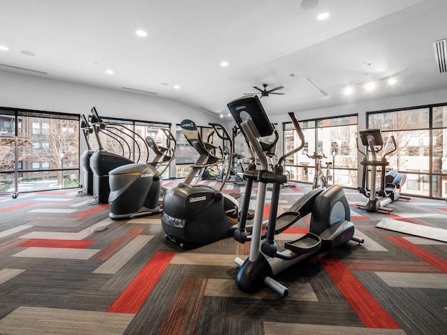 workout area with carpet floors and vaulted ceiling