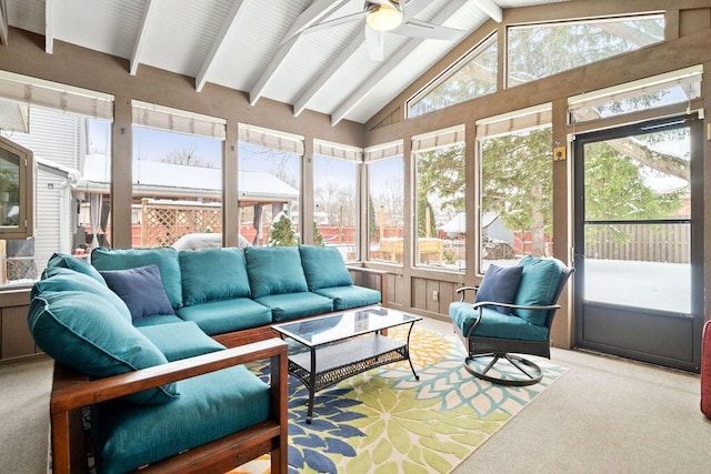 sunroom / solarium with ceiling fan and lofted ceiling with beams