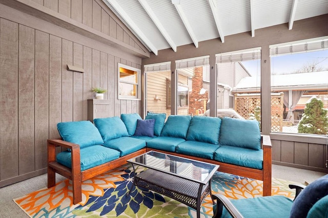 sunroom with lofted ceiling with beams