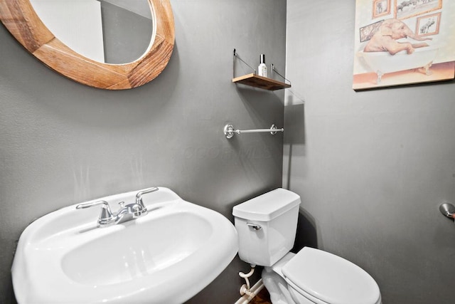 bathroom with toilet and sink