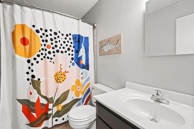 bathroom featuring a shower with curtain, vanity, a textured ceiling, and toilet