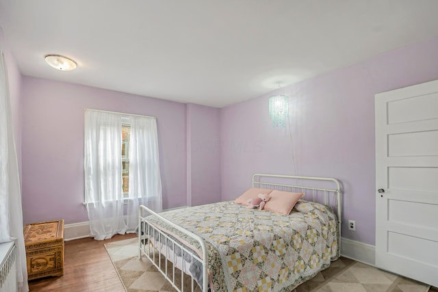 bedroom with wood-type flooring