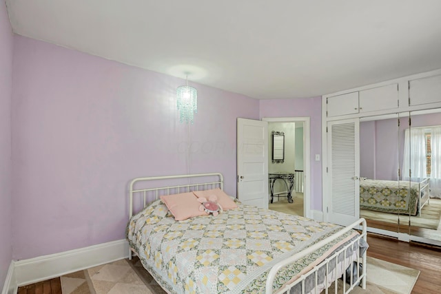 bedroom featuring a closet and light wood-type flooring