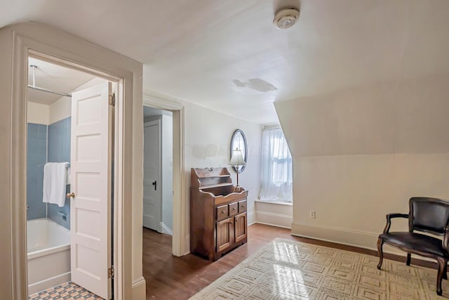 bonus room featuring lofted ceiling and hardwood / wood-style floors