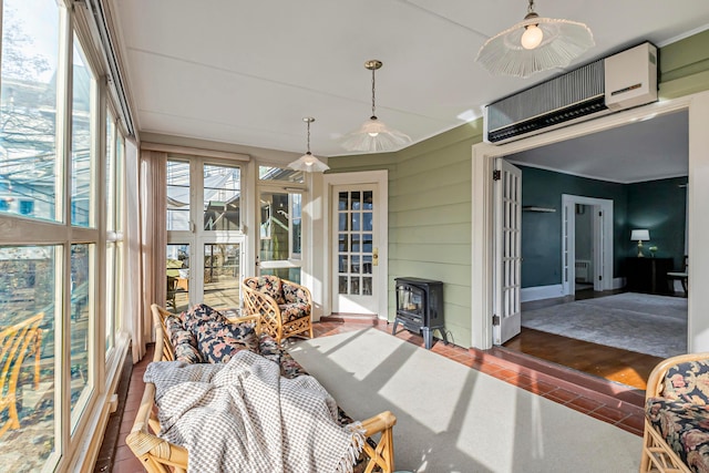 sunroom / solarium featuring a wood stove