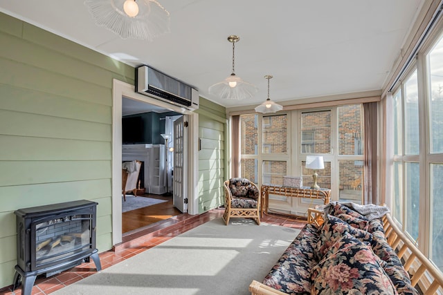 sunroom with a wall unit AC and a wood stove