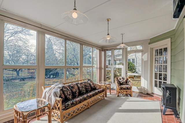 sunroom / solarium with a wood stove