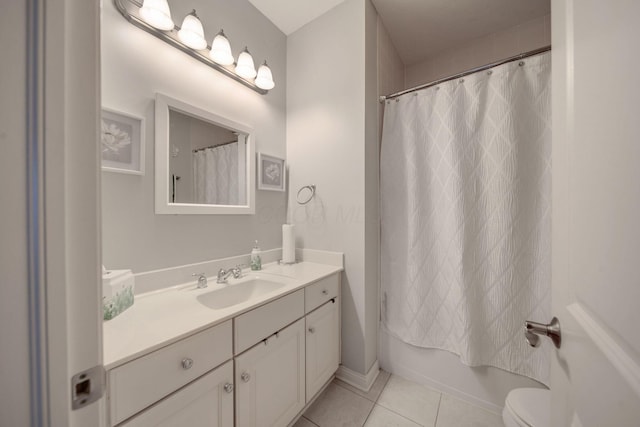 full bathroom with vanity, shower / tub combo, tile patterned floors, and toilet