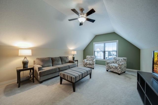 living room featuring vaulted ceiling, carpet floors, and a textured ceiling