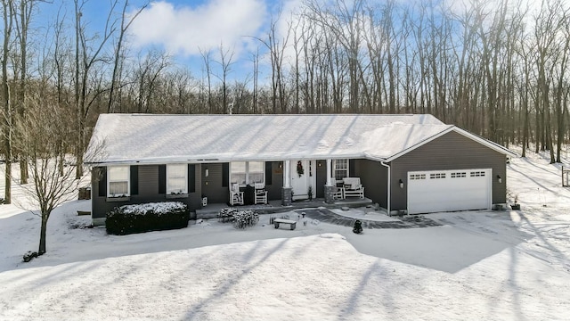 single story home with a porch and a garage