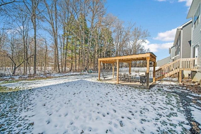 view of yard layered in snow