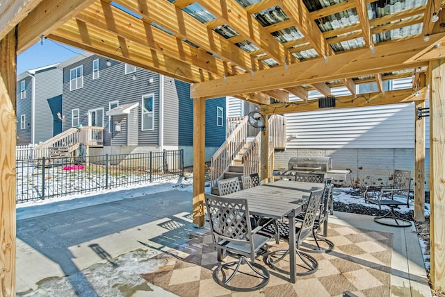 snow covered patio featuring grilling area