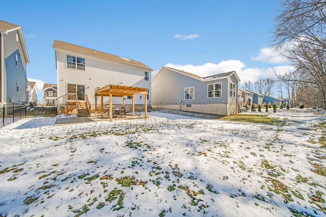 snow covered house with a pergola