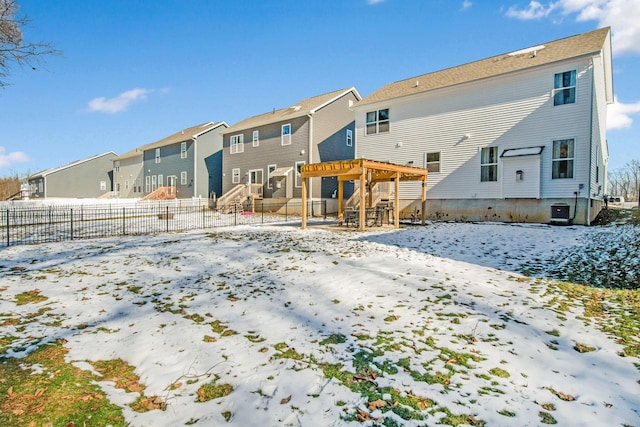 snow covered rear of property featuring a pergola and central air condition unit