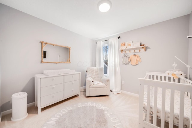 carpeted bedroom with a crib