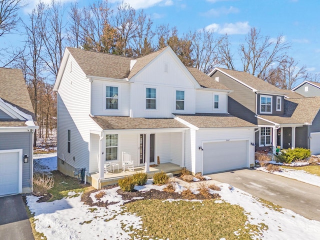 view of front property featuring a garage and a porch