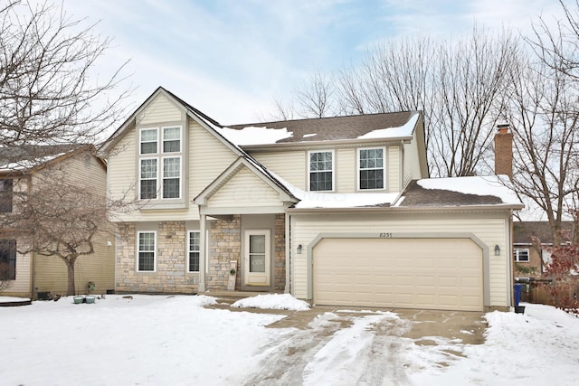 view of front of property with a garage