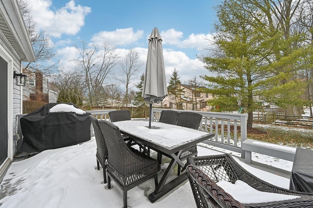 snow covered patio with grilling area