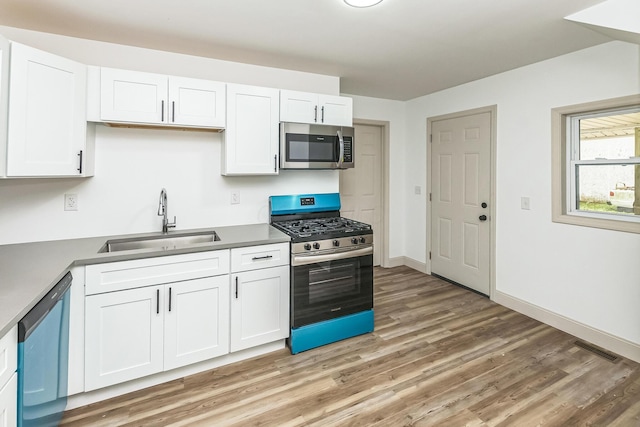 kitchen featuring white cabinets, sink, and stainless steel appliances