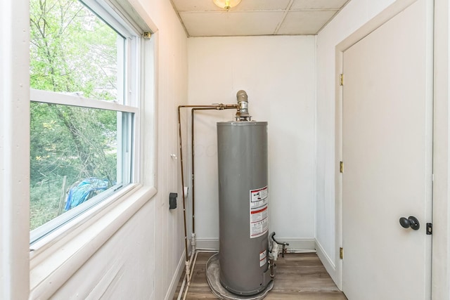 utility room featuring gas water heater