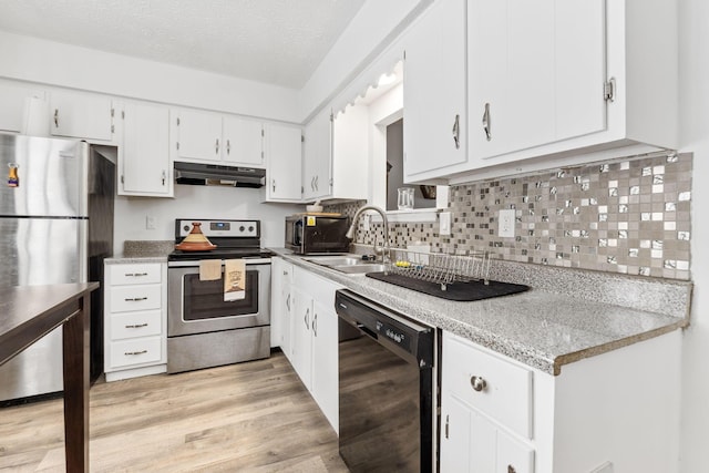 kitchen with sink, light hardwood / wood-style flooring, a textured ceiling, appliances with stainless steel finishes, and white cabinetry