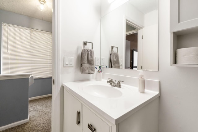 bathroom with vanity and a textured ceiling