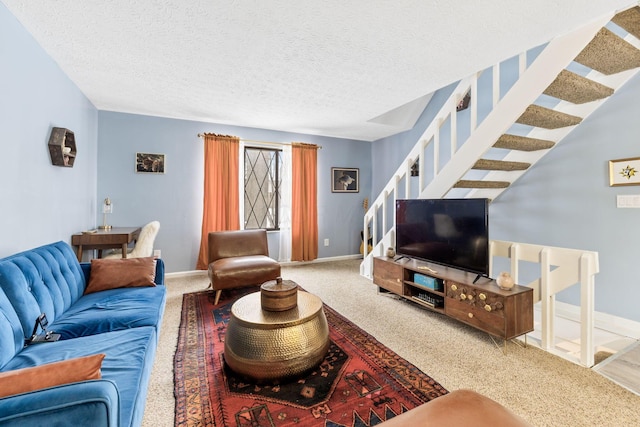 living room with carpet floors and a textured ceiling