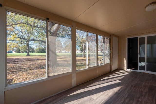 unfurnished sunroom with plenty of natural light and lofted ceiling