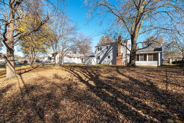 view of yard featuring a sunroom