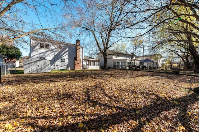 view of yard with a sunroom