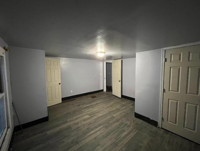 interior space with dark hardwood / wood-style floors