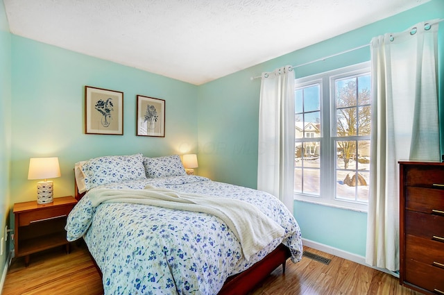 bedroom featuring wood-type flooring