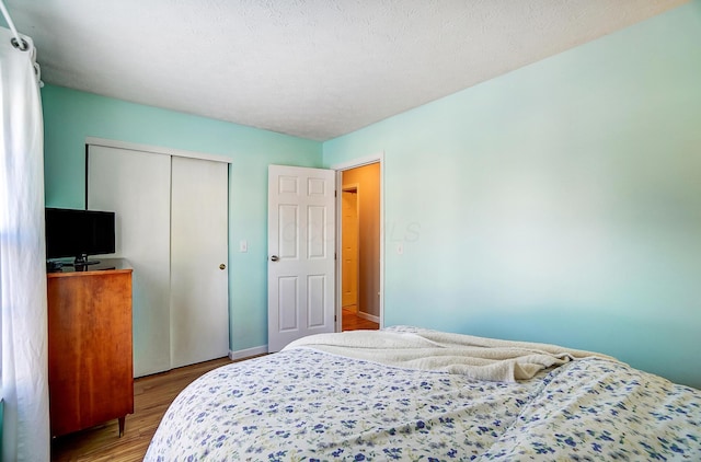 bedroom featuring a closet and hardwood / wood-style floors