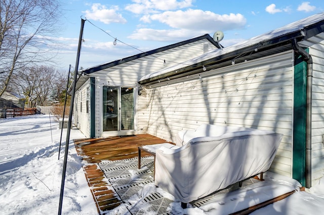 view of snow covered deck