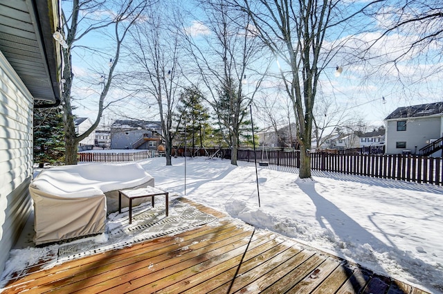 view of snow covered deck