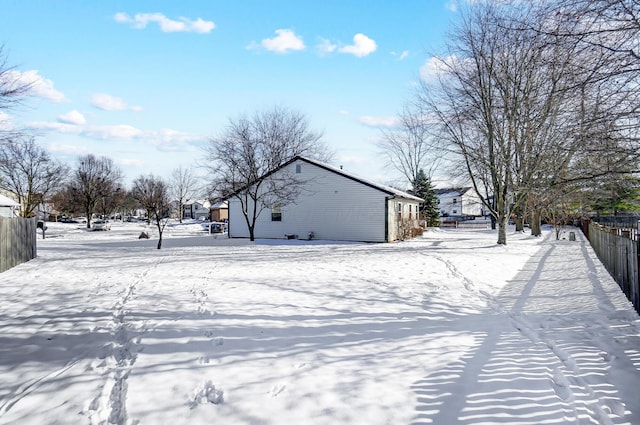 view of yard layered in snow