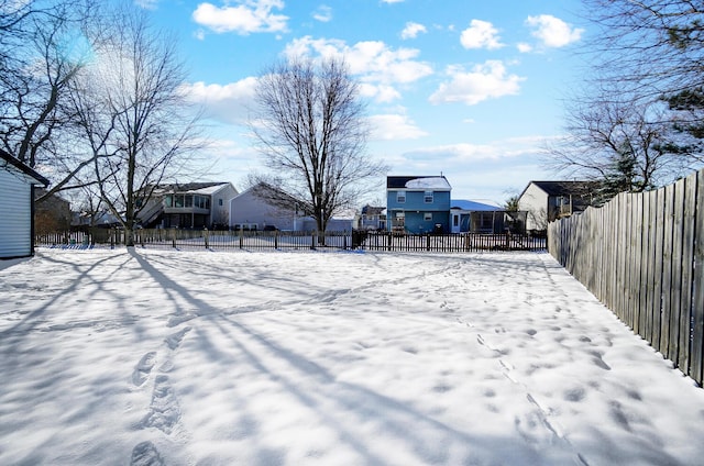 view of yard layered in snow