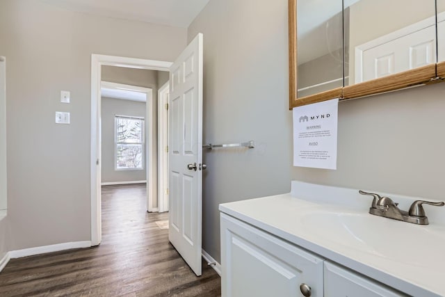 bathroom featuring vanity and hardwood / wood-style floors