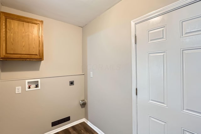 washroom featuring hookup for an electric dryer, hookup for a washing machine, cabinets, and hardwood / wood-style flooring