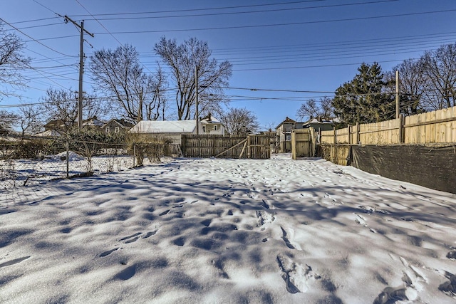 view of yard covered in snow